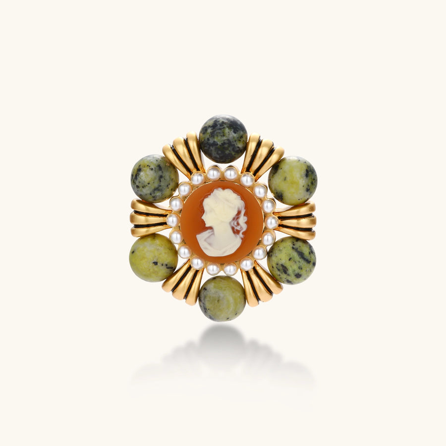 Vintage-style gold plated brooch with a cameo portrait, white bead border and six round green natural stone beads.