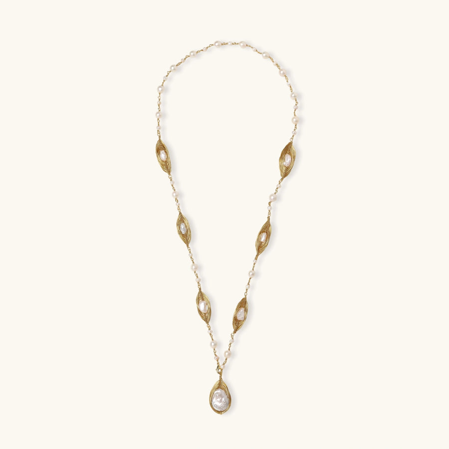 14K gold plated necklace with organic leaf motifs and freshwater pearls arranged in an elegant chain design on neutral background.