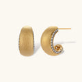 Small gold-plated hoop earrings with crystal accents and brushed finish on white background.