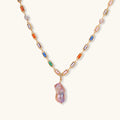Colorful statement necklace with rainbow zircon stones and iridescent baroque pearl pendant on gold-plated chain